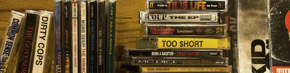 Shelf of used cassettes and CDs at Mint Underground
